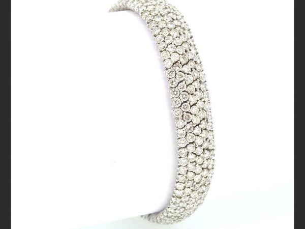 Equistite and luxurious diamond bracelet; Flexible pave setting; estimated 18.00ct total, colour G, clarity VS1; set in 18ct white gold, 22g