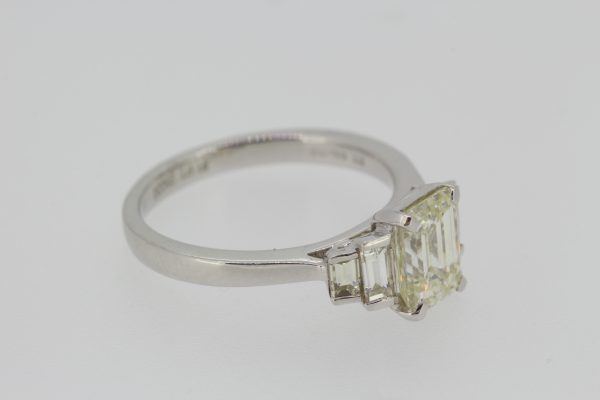 Emerald Cut Diamond Engagement Ring in Platinum; central 1.54ct emerald-cut diamond flanked by 0.43cts graduated baguette-cut diamonds to the shoulders
