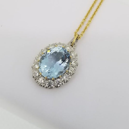 Aquamarine and Diamond Oval Cluster Pendant; large 7 carat oval faceted aquamarine surrounded by 1.84cts brilliant-cut diamonds, in 18ct white and yellow gold