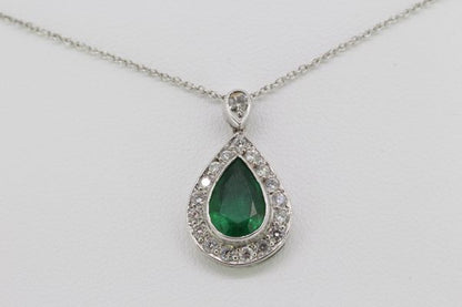 Pear Cut Emerald and Diamond Cluster Pendant; central 1.70ct pear-shaped faceted emerald within a diamond surround, suspended from a diamond-set bale, in 18ct white gold, on an 18ct white gold chain