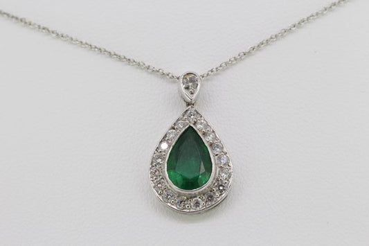 Pear Cut Emerald and Diamond Cluster Pendant; central 1.70ct pear-shaped faceted emerald within a diamond surround, suspended from a diamond-set bale, in 18ct white gold, on an 18ct white gold chain