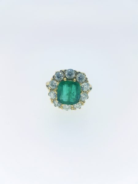 Emerald and Diamond Cluster Ring in Yellow Gold; featuring a 3.65 carat cushion-shaped emerald surrounded by 1.85cts circular cut diamonds