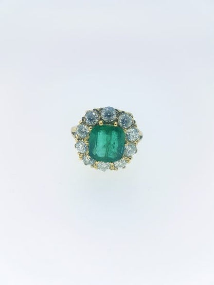 Emerald and Diamond Cluster Ring in Yellow Gold; featuring a 3.65 carat cushion-shaped emerald surrounded by 1.85cts circular cut diamonds