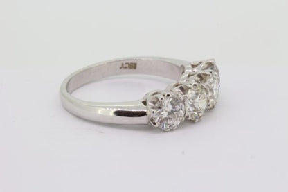 Four Stone Diamond Ring; featuring four round brilliant-cut diamonds, 2.10 carat total, claw set and mounted in 18ct white gold