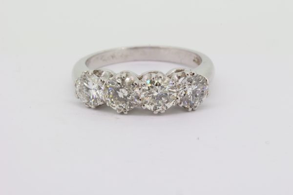 Four Stone Diamond Ring; featuring four round brilliant-cut diamonds, 2.10 carat total, claw set and mounted in 18ct white gold