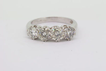 Four Stone Diamond Ring; featuring four round brilliant-cut diamonds, 2.10 carat total, claw set and mounted in 18ct white gold