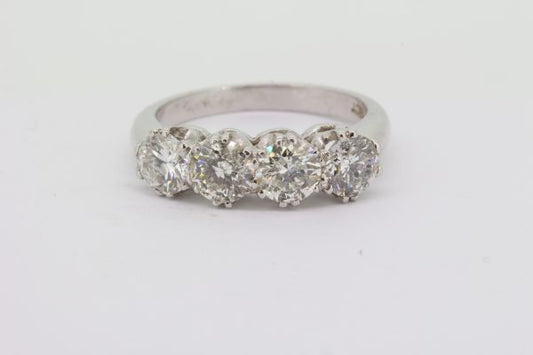 Four Stone Diamond Ring; featuring four round brilliant-cut diamonds, 2.10 carat total, claw set and mounted in 18ct white gold