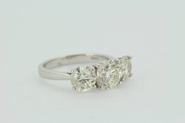 Classic Three Stone Diamond Trilogy Ring, 3.69 carat total, three round brilliant-cut diamonds, claw set to a plain 18ct white gold shank