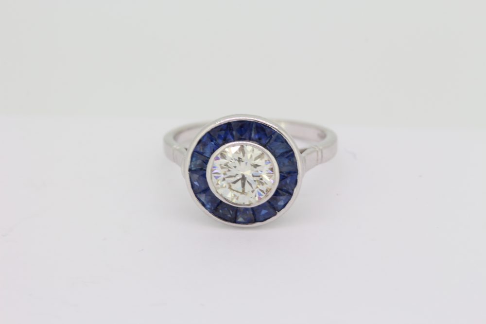 1.21ct Diamond and Calibre Sapphire Target Cluster Engagement Ring