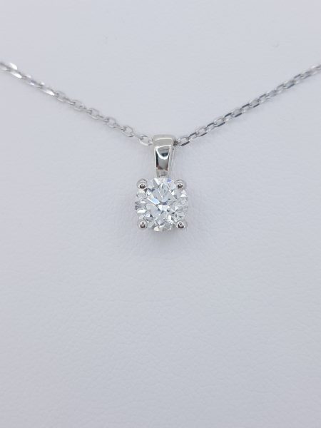 Solitaire Diamond Pendant with Chain; 0.80ct round brilliant-cut diamond, four-claw set in 18ct white gold, on 18ct white gold trace chain