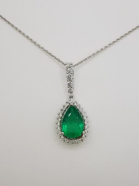 Pear Cut Emerald and Diamond Cluster Pendant; 1.60ct pear-cut emerald with diamond surround and graduated diamond set bale, in 18ct white gold with chain