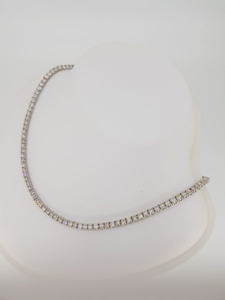 Fine Diamond Line Necklace; 17.90 carats of round brilliant cut diamonds, each four-claw set and mounted in 18ct white gold, 33cm in length