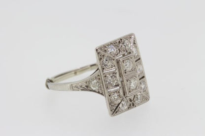 Art Deco Platinum and Diamond Plaque Dress Ring; set with old cut diamonds in a rectangular geometric form