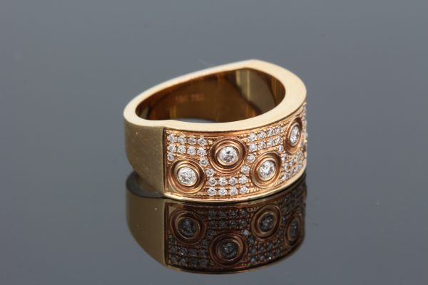 Contemporary Diamond Dress Ring in 18ct Rose Gold; seven brilliant cut diamonds in an asymmetric pattern upon a pave set diamond background, 0.59 carat total