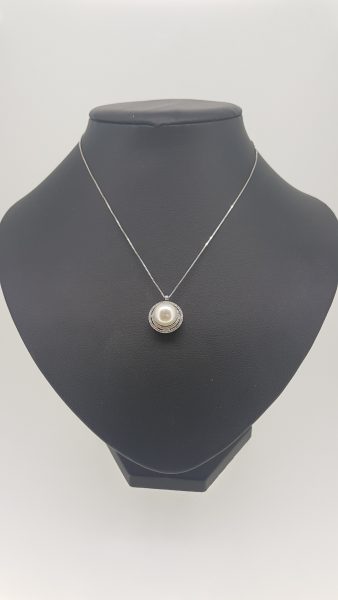Pearl and Diamond Cluster Pendant; featuring a central pearl within a double diamond surround, in 18ct white gold. Comes with chain