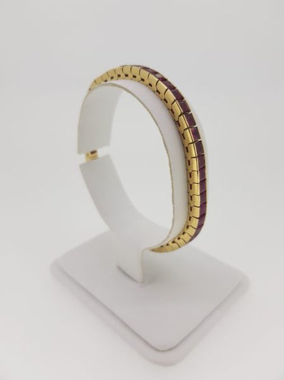 French Cut Ruby Line Bracelet in 14ct Gold, 10.00 carat total; set with 10 carats of French-cut rubies. Mounted in 14ct yellow gold