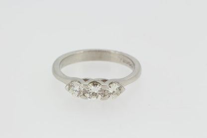 Celtic Diamond Three Stone Ring; featuring three round brilliant-cut diamonds set into a fluid mount reminiscent of a Celtic design, in 18ct white gold