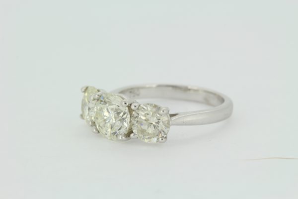 Classic Three Stone Diamond Trilogy Ring, 3.69 carat total, three round brilliant-cut diamonds, claw set to a plain 18ct white gold shank