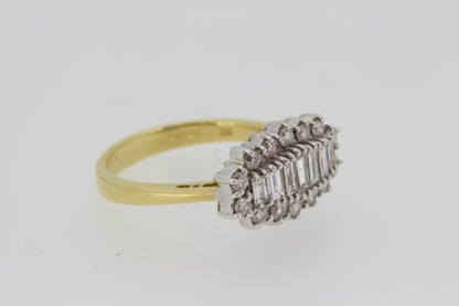 Baguette Cut Diamond Cluster Ring; central row of graduated baguette-cut diamonds within a round brilliant-cut diamond surround, 1.00 carat total, 18ct yellow gold