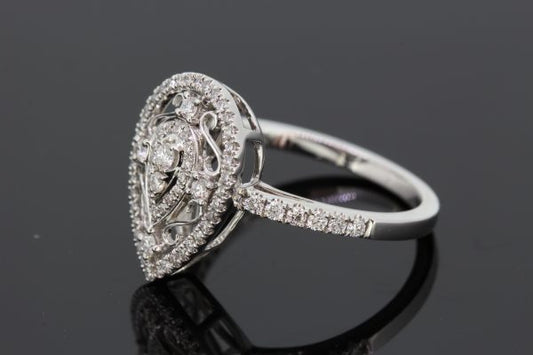Pear Shaped Diamond Cluster Dress Ring, 0.41 carats, two central round brilliant-cut diamonds within pear-shaped diamond border, surrounded by white gold scrolls with diamond accents, all within an outer pear-shaped diamond-set halo, in 18ct white gold with diamond set shoulders