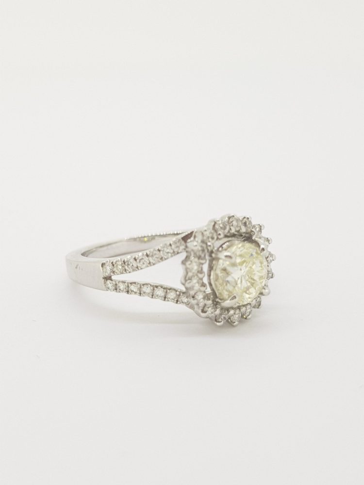 0.90ct Diamond Halo Cluster Dress Ring in 18ct White Gold; central 0.90 carat diamond surrounded by a diamond-set fixed halo and diamond-set split shoulders