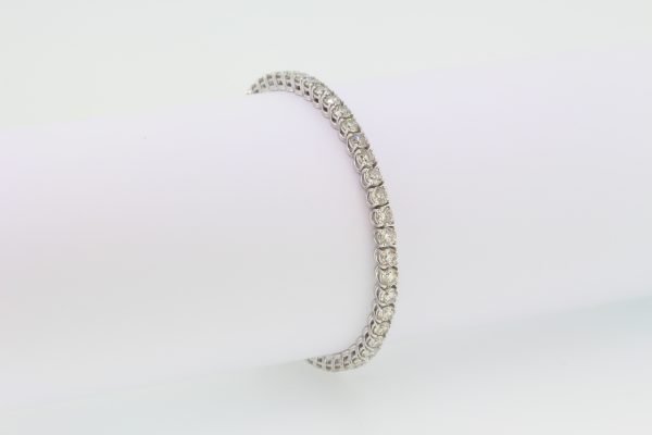 Diamond Line Bracelet in 18ct White Gold; set with 9.08 carats of round brilliant-cut diamonds, all claw set and mounted in 18ct white gold