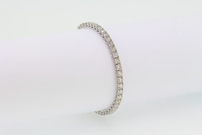 Diamond Line Bracelet in 18ct White Gold; set with 9.08 carats of round brilliant-cut diamonds, all claw set and mounted in 18ct white gold