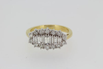 Baguette Cut Diamond Cluster Ring; central row of graduated baguette-cut diamonds within a round brilliant-cut diamond surround, 1.00 carat total, 18ct yellow gold