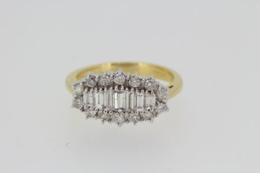 Baguette Cut Diamond Cluster Ring; central row of graduated baguette-cut diamonds within a round brilliant-cut diamond surround, 1.00 carat total, 18ct yellow gold
