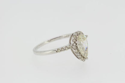 Diamond and 18ct White Gold Pear Shaped Cluster Ring; featuring a central pear-cut diamond surrounded by diamonds, with diamond set shoulders