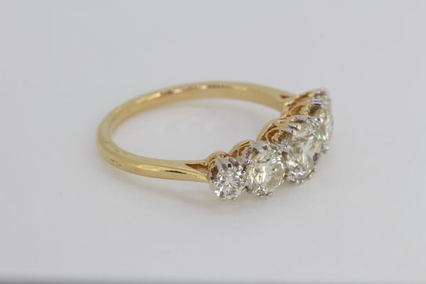 Old Cut Diamond Five Stone Ring; 2.00 carat total, featuring five graduated old-cut diamonds, claw set in white gold and mounted to a plain 18ct yellow gold shank