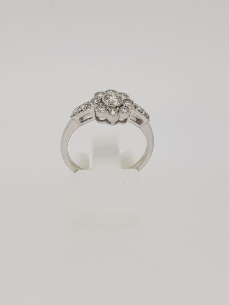 Diamond Floral Cluster Ring with diamond set shoulders, 0.80 carat total, in 18ct white gold with millegrain edges