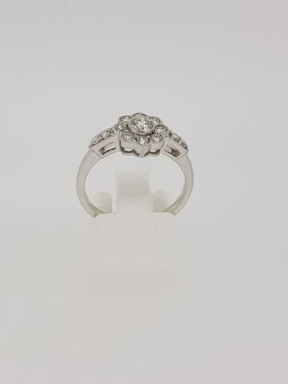 Diamond Floral Cluster Ring with diamond set shoulders, 0.80 carat total, in 18ct white gold with millegrain edges