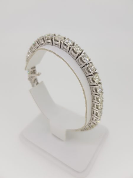 Diamond Line Bracelet; comprised of in excess of 18 carats of round brilliant-cut diamonds claw-set and mounted in 18ct white gold, 18.5cm long