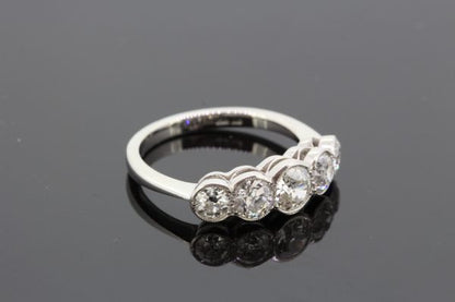 Five Stone Diamond Ring in Platinum, 1.60 carat total, featuring five graduated diamonds in collet settings and mounted in platinum