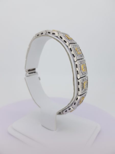 12.80ct Baguette Cut Diamond Link Bracelet; each square link comprises of a central brilliant-cut diamond cluster within a yellow gold setting, all within a baguette-cut diamond surround, in 18ct white gold, 12.80 carat total