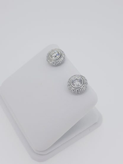 A pair of diamond round cluster earrings in white gold