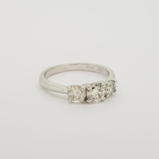 Diamond Three Stone Ring, 0.75 carat total, classic diamond trilogy ring featuring three round brilliant-cut diamonds claw-set in 18ct white gold
