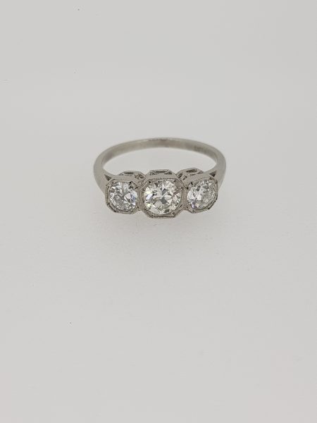 Diamond Three Stone Ring in Platinum, 1.25 carat total, featuring three diamonds set in square collets with delicate millegrain edging