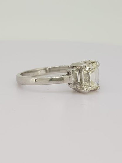 Emerald Cut Diamond Ring with Baguette Diamond Shoulders; 1.03 carat emerald-cut diamond, flanked by 0.24cts baguette cut diamonds, in 18ct white gold