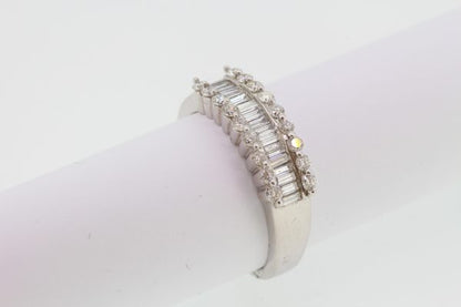 Channel Set Baguette Cut Diamond Ring; central row of channel-set baguette-cut diamonds flanked either side by a row of brilliant-cut diamonds, 1.66 carat total, in 18ct white gold