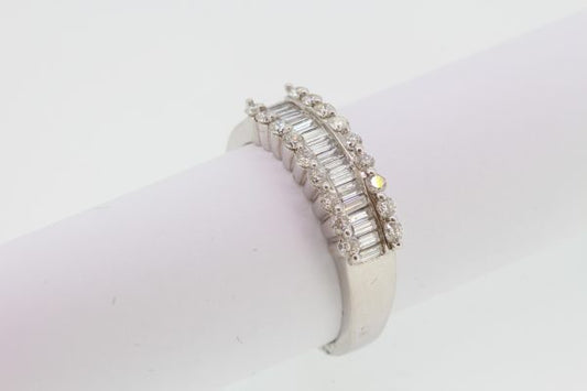 Channel Set Baguette Cut Diamond Ring; central row of channel-set baguette-cut diamonds flanked either side by a row of brilliant-cut diamonds, 1.66 carat total, in 18ct white gold