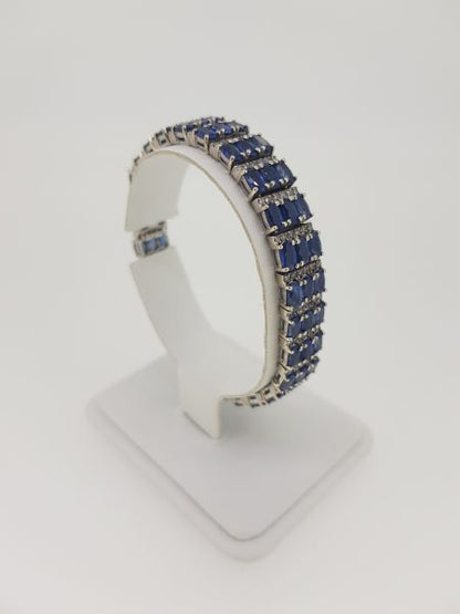 Oval Cut Sapphire and Diamond Bracelet; comprising of three rows of alternated 12.00cts oval faceted sapphires and 1.80cts diamonds, in 14ct gold