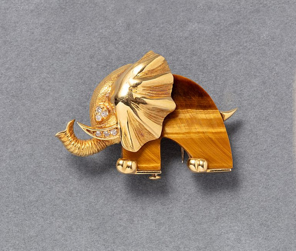 A vintage 18ct yellow gold tigers eye quartz and diamond elephant brooch