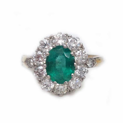 Emerald and diamond engagement ring cluster