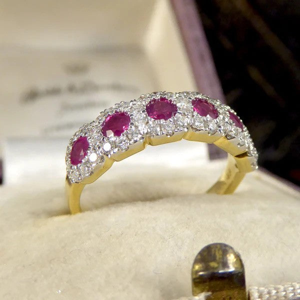 Ruby and diamond cluster ring in gold.