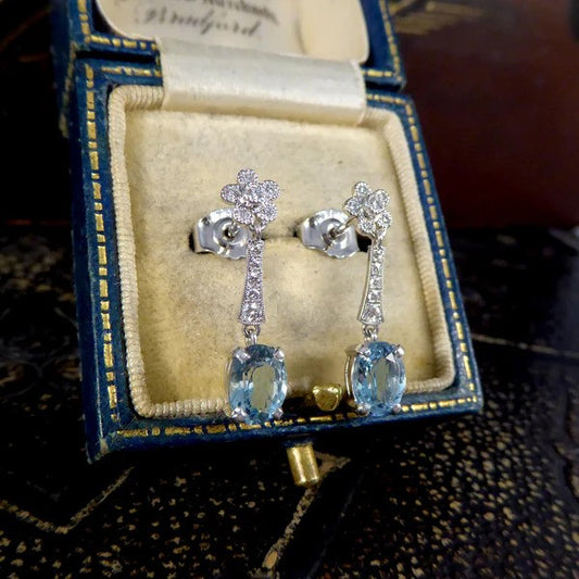 Diamond and aquamarine drop earrings in white gold