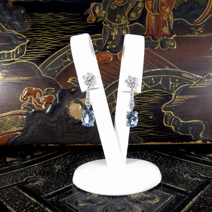 Diamond and aquamarine drop earrings in white gold