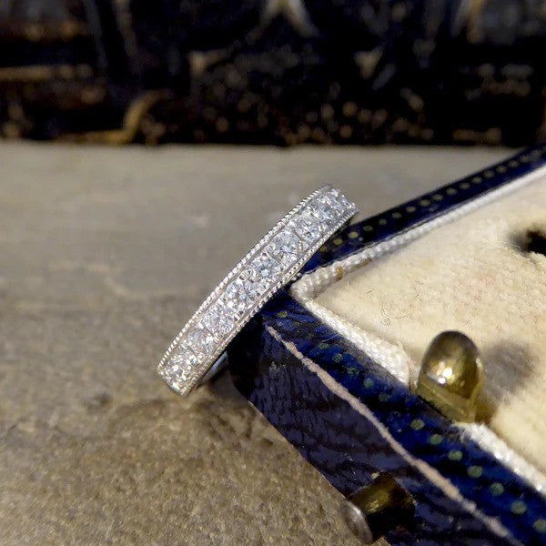 Platinum half eternity ring with diamonds.