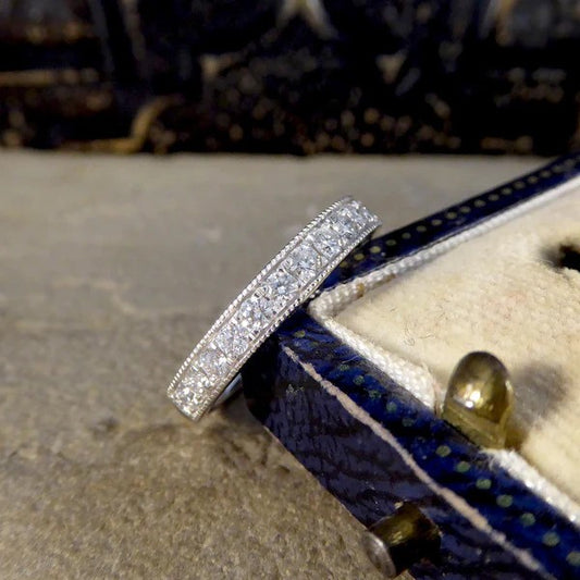 Platinum half eternity ring with diamonds.
